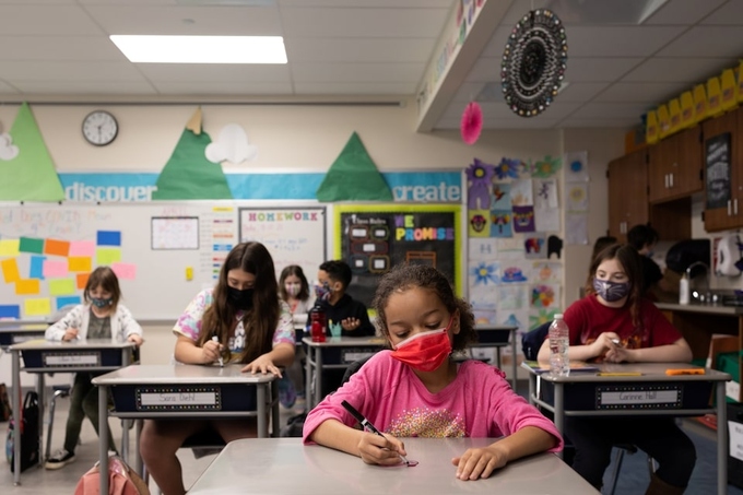 Students drew on their desks to visually portray this idea with dry erasable markers at Kratzer Elementary School in Allentown, Pennsylvania, U.S. April 13, 2021. Photo by Reuters