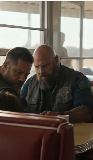 THE LITTLE GIRL GRABBED THE BIKER’S VEST AND WHISPERED, “THAT’S NOT MY DAD” — THEN 200 RIDERS STOOD UP